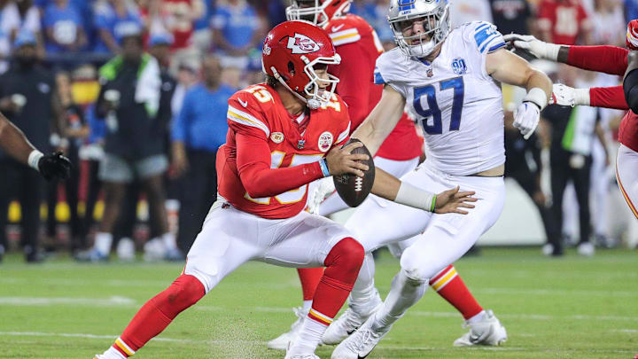 Detroit Lions defensive end Aidan Hutchinson (97) looks to tackle Kansas City Chiefs quarterback
