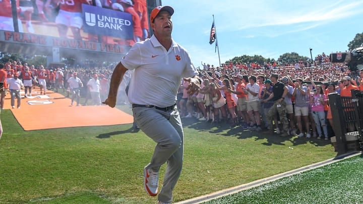 Sep 21, 2024; Clemson, South Carolina, USA; Clemson Tigers head coach Dabo Swinney runs down the hill before kickoff against the North Carolina State Wolfpack at Memorial Stadium. Mandatory Credit: Ken Ruinard-Imagn Images