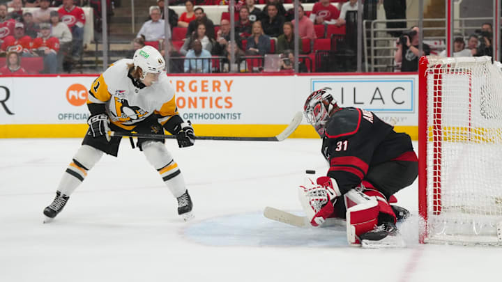 Mar 10, 2026; Raleigh, North Carolina, USA;  Carolina Hurricanes goaltender Frederik Andersen (31) stops the tips shot by Pittsburgh Penguins right wing Ville Koivunen (41) during the second period at Lenovo Center. Mandatory Credit: James Guillory-Imagn Images