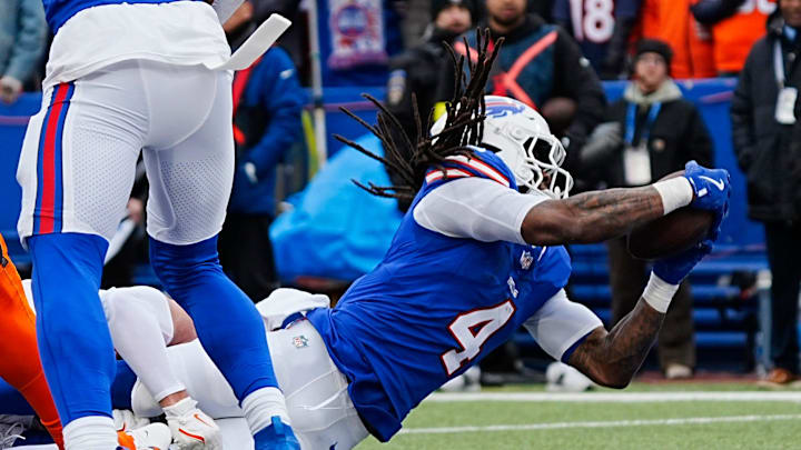 Buffalo Bills running back James Cook (4) scores a touchdown during the first half of the Buffalo Bills wild card game against the Denver Broncos at Highmark Stadium in Orchard Park on Jan. 12, 2025.