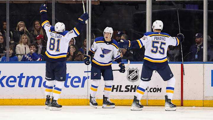 Nov 25, 2024; New York, New York, USA; St. Louis Blues center Zack Bolduc (76) celebrates his goal with center Dylan Holloway (81) and defenseman Colton Parayko (55) during the second period against the New York Rangers at Madison Square Garden. Mandatory Credit: Danny Wild-Imagn Images