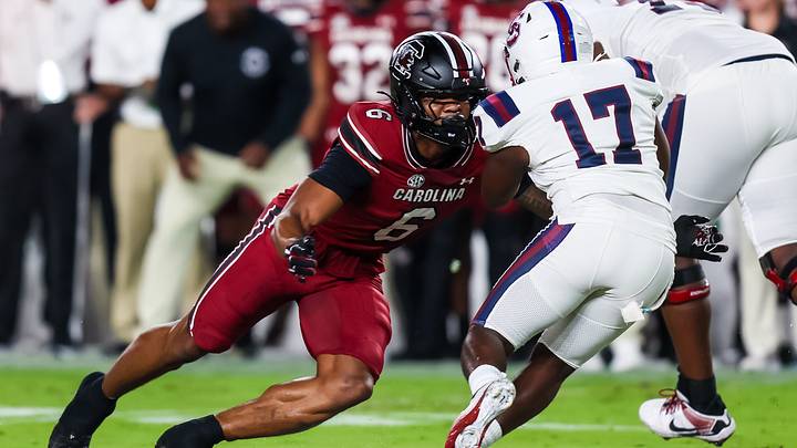 Sep 6, 2025; Columbia, South Carolina, USA; South Carolina Gamecocks linebacker Dylan Stewart (6) brings down South Carolina State Bulldogs running back KZ Adams (17) in the first quarter at Williams-Brice Stadium. Mandatory Credit: Jeff Blake-Imagn Images