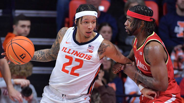 Jan 23, 2025; Champaign, Illinois, USA;  Illinois Fighting Illini guard Tre White (22) drives to the basket as Maryland Terrapins guard Selton Miguel (9) defends during the second half at State Farm Center. Mandatory Credit: Ron Johnson-Imagn Images
