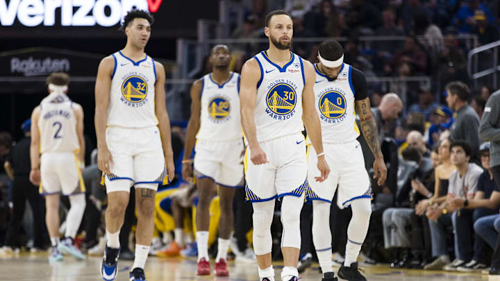 Mar 18, 2024; San Francisco, California, USA; Golden State Warriors guard Stephen Curry (30) and guard Brandin Podziemski (2) and other players walk on the court after a time-out during the first half of the game against the New York Knicks at Chase Center. Mandatory Credit: John Hefti-Imagn Images