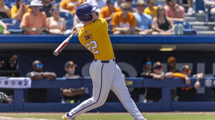 May 26, 2024; Hoover, AL, USA; LSU Tigers infielder Jared Jones (22) hits a solo home run against the Tennessee Volunteers during the championship game between Tennessee and LSU at the SEC Baseball Tournament at Hoover Metropolitan Stadium. Mandatory Credit: Vasha Hunt-Imagn Images
