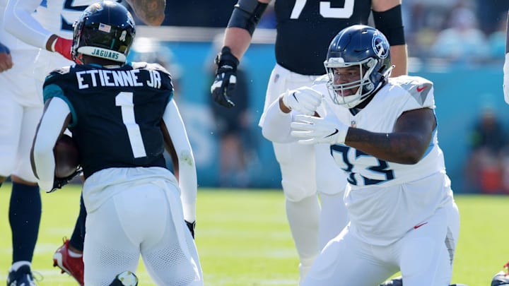 Tennessee Titans Teair Tart (93) makes an eating motion after a late first quarter tackle on Jacksonville Jaguars running back Travis Etienne Jr. (1). The Jacksonville Jaguars hosted the Tennessee Titans at EverBank Stadium in Jacksonville, FL Sunday, November 19, 2023. The Jaguars led 13 to 0 at the half. [Bob Self/Florida Times-Union]