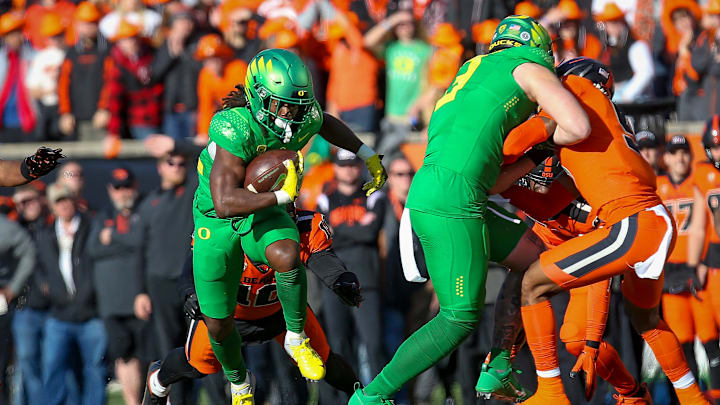 Oregon running back Noah Whittington carries the ball for the Ducks as the No. 9 Oregon Ducks take on the No. 21 Oregon State Beavers at Reser Stadium in Corvallis, Ore. Saturday, Nov. 26, 2022.

Ncaa Football Uo Vs Osu Rivalry Game University Of Oregon At Oregon State