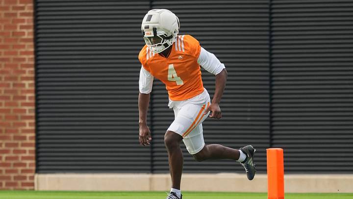 Tennessee defensive back Ty Redmond (4) runs at a Tennessee football preseason practice in Knoxville, Tenn., on Aug. 12, 2026.