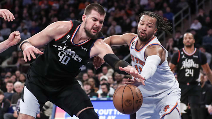 Feb 4, 2023; New York, New York, USA;  LA Clippers center Ivica Zubac (40) and New York Knicks guard Jalen Brunson (11) fight for a loose ball in the fourth quarter at Madison Square Garden. Mandatory Credit: Wendell Cruz-Imagn Images