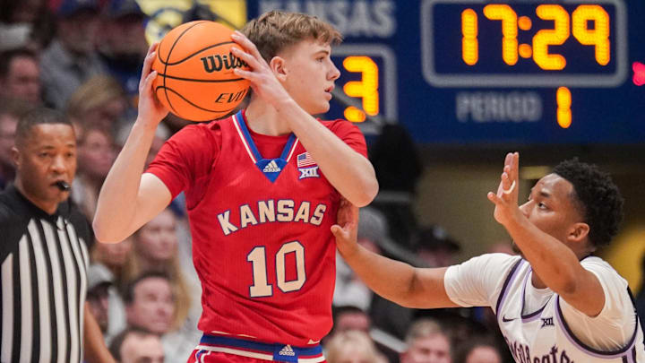 Mar 5, 2024; Lawrence, Kansas, USA; Kansas Jayhawks guard Johnny Furphy (10) looks to pass as Kansas State Wildcats guard Tylor Perry (2) defends during the first half at Allen Fieldhouse. 