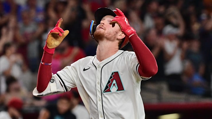 Sep 25, 2024; Phoenix, Arizona, USA; Arizona Diamondbacks outfielder Pavin Smith (26) hits a three-run home run in the eighth inning against the San Francisco Giants at Chase Field. Mandatory Credit: Matt Kartozian-Imagn Images