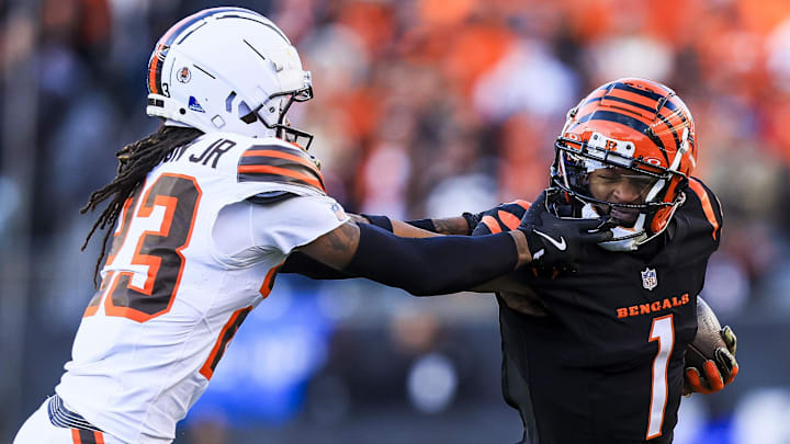 Dec 22, 2024; Cincinnati, Ohio, USA; Cincinnati Bengals wide receiver Ja'Marr Chase (1) runs with the ball against Cleveland Browns cornerback Martin Emerson Jr. (23) in the second half at Paycor Stadium. Mandatory Credit: Katie Stratman-Imagn Images