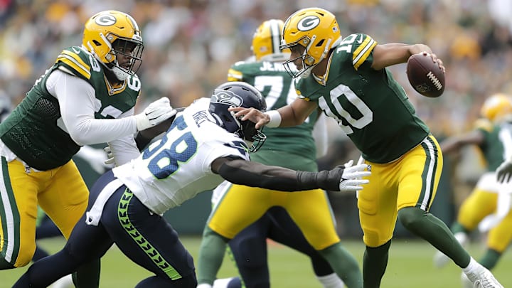 Aug 26, 2023; Green Bay, WI, USA; Green Bay Packers quarterback Jordan Love (10) dodges pressure from Seattle Seahawks linebacker Derick Hall (58) in a preseason football game at Lambeau Field. Mandatory Credit: Wm. Glasheen-Imagn Images Aug 26, 2023; Green Bay, WI, USA; Green Bay Packers quarterback Jordan Love (10) dodges pressure from Seattle Seahawks linebacker Derick Hall (58) in a preseason football game at Lambeau Field. Mandatory Credit: Wm. Glasheen-Imagn Images