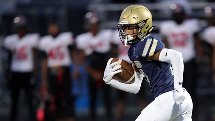 Hoban's Elbert Hill IV returns a first-half kick 92 yards for a touchdown against Glenville, Friday, Oct. 6, 2023.