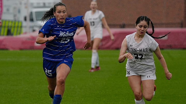 Waukee Northwest's midfielder/forward Romey Croatt (25) and Linn-Mar midfielder Sofia Romero (23) battle for the ball during the first half in the 3A girls state soccer championship at the Cyclone Sports Complex on Saturday, June 7, 2025, in Ames, Iowa.