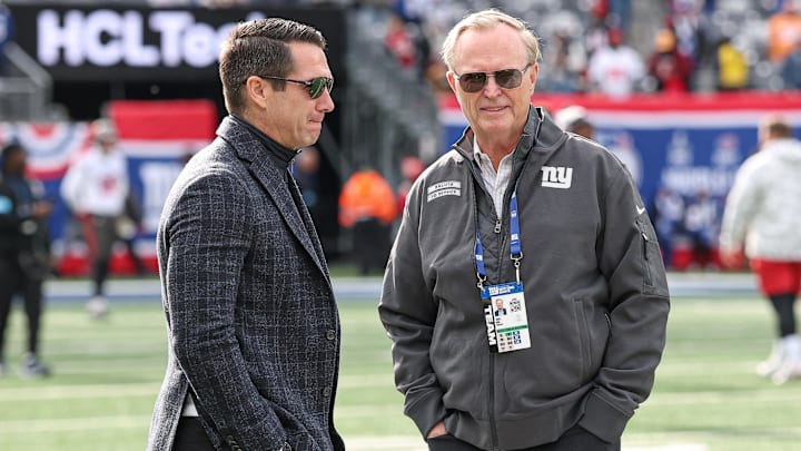 Nov 24, 2024; East Rutherford, New Jersey, USA; New York Giants owner John Mara, left, and New York Giants general manager Joe Schoen on the field before the game between the Giants and the Tampa Bay Buccaneers at MetLife Stadium.  