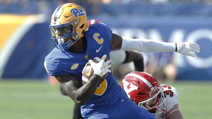 Sep 21, 2024; Pittsburgh, Pennsylvania, USA; Pittsburgh Panthers wide receiver Konata Mumpfield (9) runs after a catch against the Youngstown State Penguins during the first quarter at Acrisure Stadium. Mandatory Credit: Charles LeClaire-Imagn Images