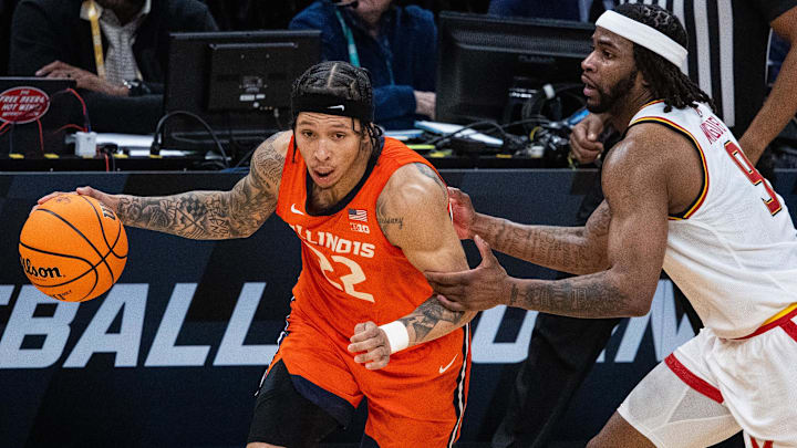 Mar 14, 2025; Indianapolis, IN, USA; Illinois Fighting Illini guard Tre White (22) dribbles the ball while Maryland Terrapins guard Selton Miguel (9) defends in the first half  at Gainbridge Fieldhouse. Mandatory Credit: Trevor Ruszkowski-Imagn Images