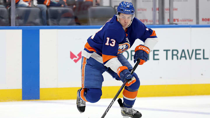 Jan 25, 2025; Elmont, New York, USA; New York Islanders center Mathew Barzal (13) controls the puck against the Carolina Hurricanes during the third period at UBS Arena. Mandatory Credit: Brad Penner-Imagn Images
