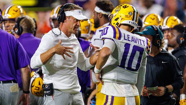 Sep 5, 2026; Baton Rouge, Louisiana, USA; LSU Tigers head coach Lane Kiffin talks to quarterback Sam Leavitt (10) against Clemson Tigers during the first half at Tiger Stadium. Mandatory Credit: Stephen Lew-Imagn Images Sep 5, 2026; Baton Rouge, Louisiana, USA; LSU Tigers head coach Lane Kiffin talks to quarterback Sam Leavitt (10) against Clemson Tigers during the first half at Tiger Stadium. Mandatory Credit: Stephen Lew-Imagn Images