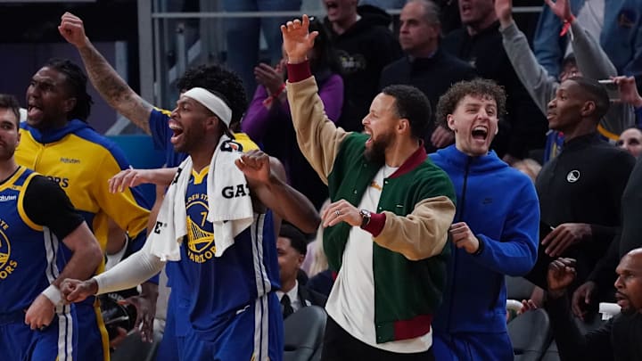 Jan 4, 2025; San Francisco, California, USA;  Golden State Warriors guard Buddy Hield, guard Stephen Curry, and guard Brandin Podziemski celebrate after the Warriors scored against the Memphis Grizzlies in the fourth quarter at Chase Center. Mandatory Credit: David Gonzales-Imagn Images