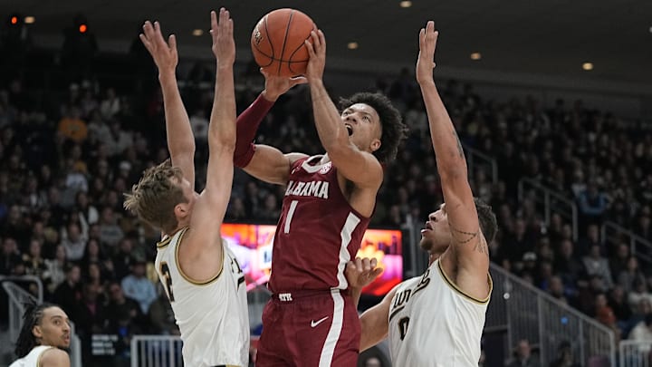 Alabama Crimson Tide guard Mark Sears makes a basket against Purdue Boilermakers forward Mason Gillis & guard Fletcher Loyer