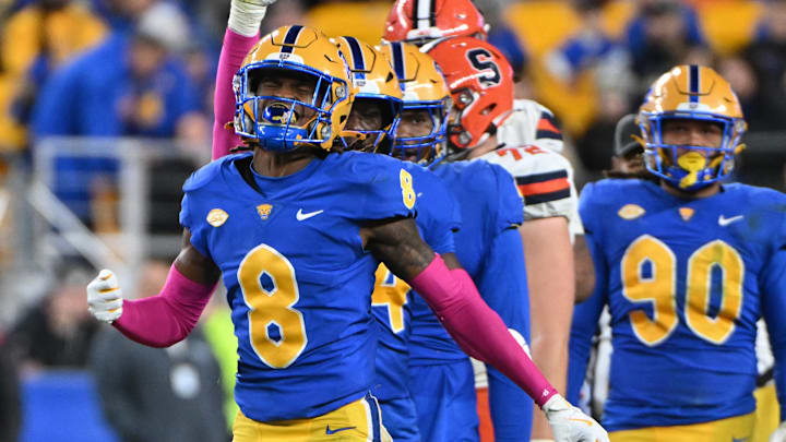 Oct 24, 2024; Pittsburgh, Pennsylvania, USA; Pittsburgh Panthers defensive back Tamon Lynum (8) celebrates a tackle of Syracuse Orange running back LeQuint Allen (1) during the third quarter at Acrisure Stadium. Mandatory Credit: Barry Reeger-Imagn Images Oct 24, 2024; Pittsburgh, Pennsylvania, USA; Pittsburgh Panthers defensive back Tamon Lynum (8) celebrates a tackle of Syracuse Orange running back LeQuint Allen (1) during the third quarter at Acrisure Stadium. Mandatory Credit: Barry Reeger-Imagn Images