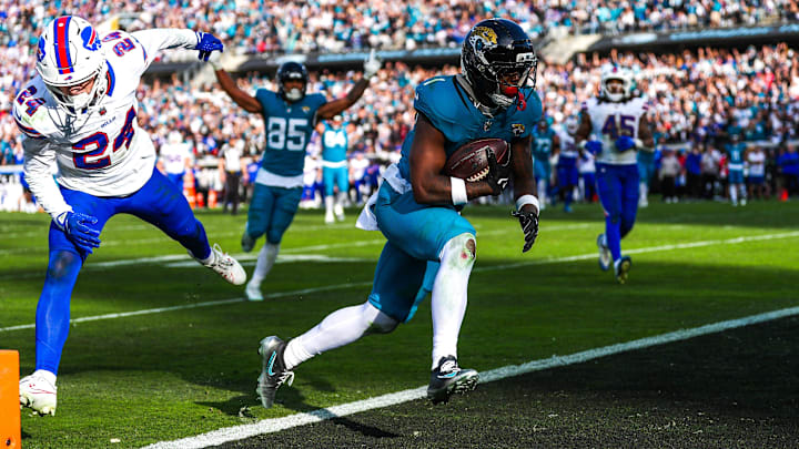 Jacksonville Jaguars running back Travis Etienne Jr. (1) scores a touchdown during the fourth quarter in an NFL football AFC Wild Card playoff matchup, Sunday, Jan. 11, 2026, in Jacksonville, Fla. Bills lead 10-7 at the half over the Jaguars. The Bills defeated the Jaguars 27-24. [Doug Engle/Florida Times-Union]