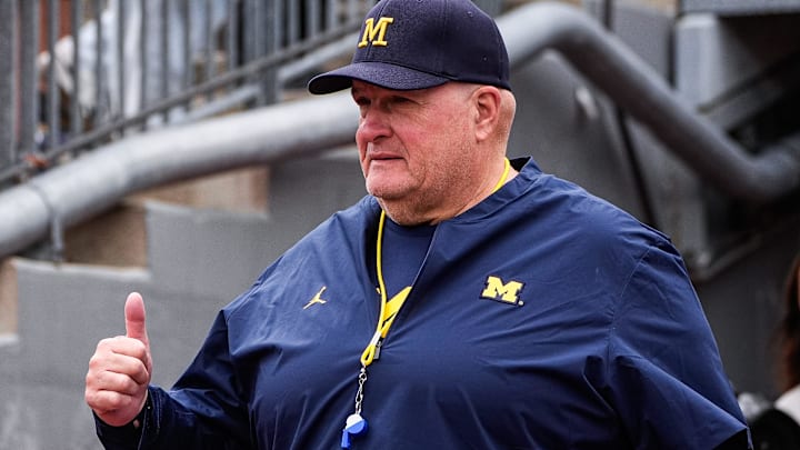 Michigan acting head coach Biff Poggi waves at fans at warm up at Michigan Stadium in Ann Arbor on Saturday, Sept. 13, 2025. Michigan acting head coach Biff Poggi waves at fans at warm up at Michigan Stadium in Ann Arbor on Saturday, Sept. 13, 2025.