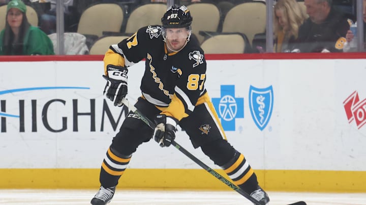 Mar 11, 2025; Pittsburgh, Pennsylvania, USA;  Pittsburgh Penguins center Sidney Crosby (87) handles the puck against the Vegas Golden Knights during the second period at PPG Paints Arena. Mandatory Credit: Charles LeClaire-Imagn Images