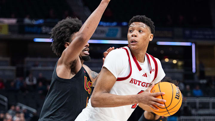Mar 12, 2025; Indianapolis, IN, USA;  Rutgers Scarlet Knights guard Ace Bailey (4) shoots the ball while USC Trojans guard Kevin Patton Jr. (8) defends in the second half at Gainbridge Fieldhouse. Mandatory Credit: Trevor Ruszkowski-Imagn Images
