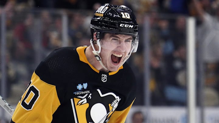 Feb 20, 2024; Pittsburgh, Pennsylvania, USA; Pittsburgh Penguins left wing Drew O'Connor (10) reacts after scoring a goal against the New York Islanders during the third period at PPG Paints Arena. New York won 5-4 in overtime.Mandatory Credit: Charles LeClaire-Imagn Images