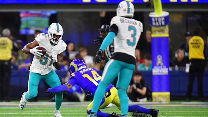 Miami Dolphins running back Raheem Mostert (31) runs the ball against the Los Angeles Rams during the first half at SoFi Stadium. 