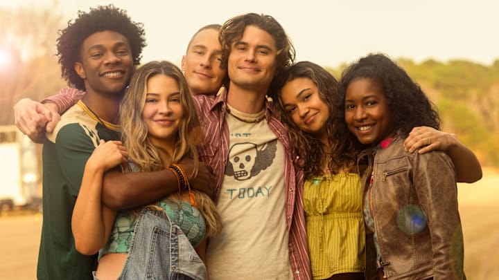 Outer Banks. (L to R) Jonathan Daviss as Pope, Madelyn Cline as Sarah Cameron, Drew Starkey as Rafe, Chase Stokes as John B, Madison Bailey as Kiara, Carlacia Grant as Cleo in season 5 of Outer Banks Outer Banks. (L to R) Jonathan Daviss as Pope, Madelyn Cline as Sarah Cameron, Drew Starkey as Rafe, Chase Stokes as John B, Madison Bailey as Kiara, Carlacia Grant as Cleo in season 5 of Outer Banks