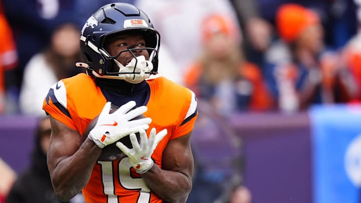 Jan 25, 2026; Denver, CO, USA; Denver Broncos wide receiver Marvin Mims Jr. (19) makes a catch against the New England Patriots during the first half in the 2026 AFC Championship Game at Empower Field at Mile High. 