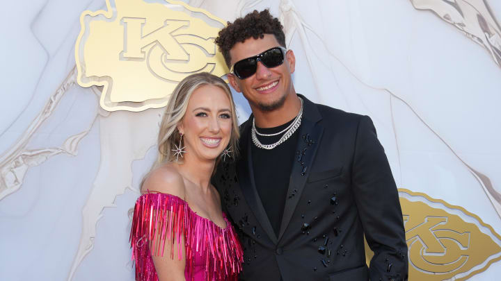 Kansas City Chiefs quarterback Patrick Mahomes and wife Brittany pose for a photo on the red carpet at the Nelson Art Gallery.