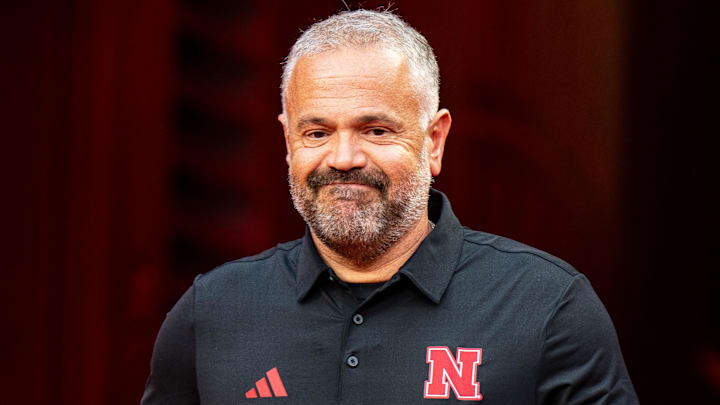 Matt Rhule walks onto the field during warmups before the game against the Cincinnati Bearcats at GEHA Field at Arrowhead Stadium.
