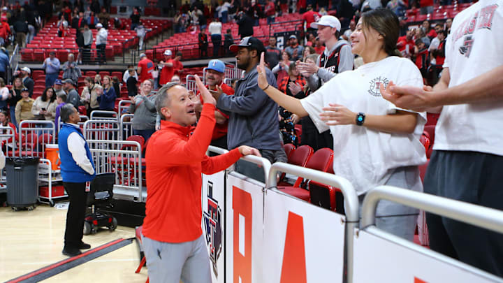 Jan 1, 2024; Lubbock, Texas, USA;  Texas Tech Red Raiders head coach Grant McCasland high fives fans