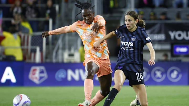 Orlando Pride forward Barbra Banda (22) plays the ball defend by Washington Spirit midfielder Paige Metayer (26) at Audi Field 