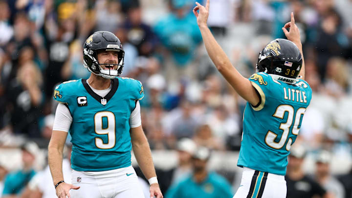 Oct 6, 2024; Jacksonville, Florida, USA; Jacksonville Jaguars place kicker Cam Little (39) celebrates with punter Logan Cooke (9) after kicking a game winning field goal against the Indianapolis Colts in the fourth quarter at EverBank Stadium. Mandatory Credit: Nathan Ray Seebeck-Imagn Images