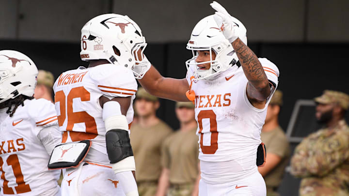 Oct 26, 2024; Nashville, Tennessee, USA;  Texas Longhorns running back Quintrevion Wisner (26) celebrates the touchdown of wide receiver DeAndre Moore Jr. (0) against the Vanderbilt Commodores during the first half at FirstBank Stadium. Mandatory Credit: Steve Roberts-Imagn Images