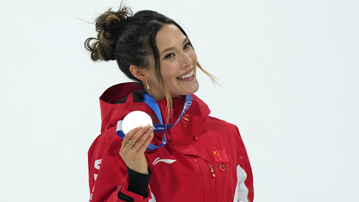 Feb 16, 2026; Livigno, Italy; Silver medalist Ailing Eileen Gu of the People's Republic of China celebrates during the medal ceremony for the women's big air final during the Milano Cortina 2026 Olympic Winter Games at Livigno Snow Park. Mandatory Credit: Joe Camporeale-Imagn Images