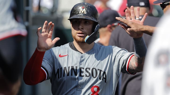 Minnesota Twins catcher Christian Vazquez receives congratulations from teammates after scoring in the ninth inning against the Detroit Tigers at Comerica Park in Detroit on July 28, 2024. Minnesota Twins catcher Christian Vazquez receives congratulations from teammates after scoring in the ninth inning against the Detroit Tigers at Comerica Park in Detroit on July 28, 2024.