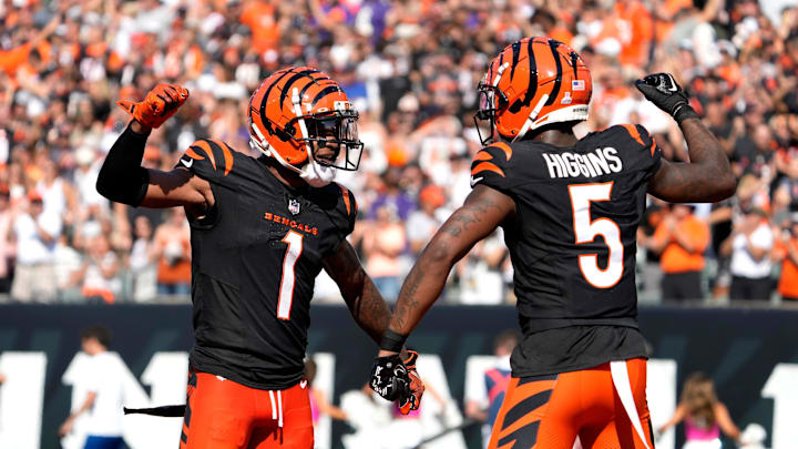 Cincinnati Bengals wide receiver Ja'Marr Chase (1) and wide receiver Tee Higgins (5) celebrate Higgins touchdown in the 3rd quarter over the Baltimore Ravens on Sunday, October 6, 2024, at Payor Stadium.