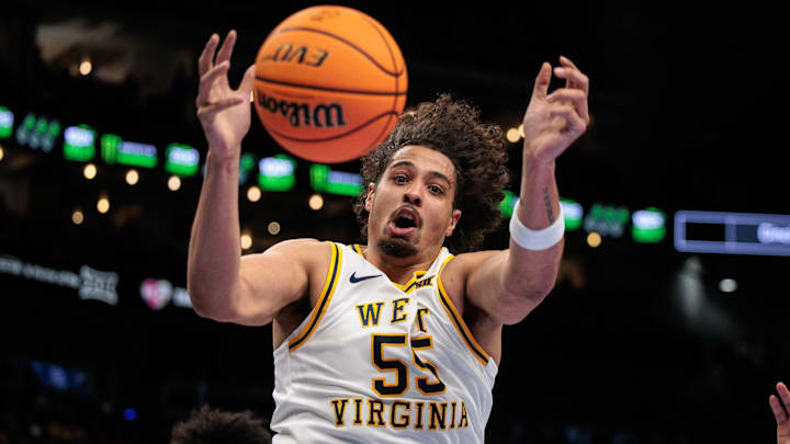 Mar 11, 2026; Kansas City, MO, USA; West Virginia Mountaineers center Harlan Obioha (55) loses control of the ball during the first half against the BYU Cougars at T-Mobile Center. Mandatory Credit: William Purnell-Imagn Images Mar 11, 2026; Kansas City, MO, USA; West Virginia Mountaineers center Harlan Obioha (55) loses control of the ball during the first half against the BYU Cougars at T-Mobile Center. Mandatory Credit: William Purnell-Imagn Images