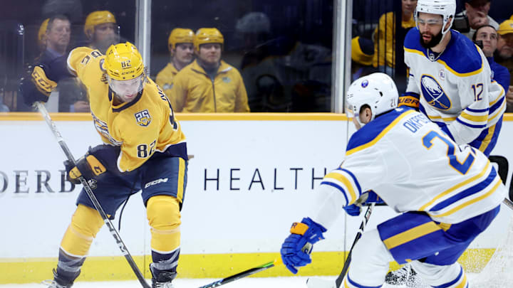 Mar 7, 2024; Nashville, Tennessee, USA; Nashville Predators center Tommy Novak (82) attempts to get