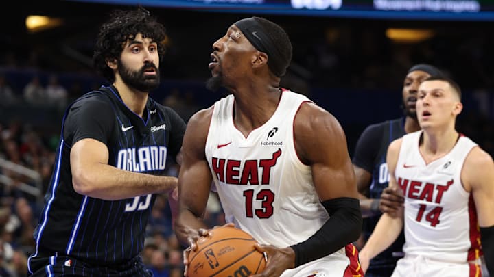 Miami Heat center Bam Adebayo (13) is guarded by Orlando Magic center Goga Bitadze (35) in the first quarter at Kia Center.