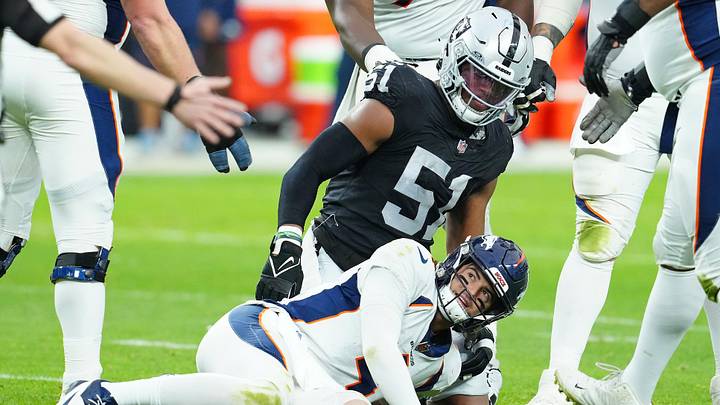 Jan 7, 2024; Paradise, Nevada, USA; Denver Broncos quarterback Jarrett Stidham (4) reacts after being knocked down by Las Vegas Raiders defensive end Malcolm Koonce (51) during the second quarter at Allegiant Stadium. Mandatory Credit: Stephen R. Sylvanie-USA TODAY Sports Jan 7, 2024; Paradise, Nevada, USA; Denver Broncos quarterback Jarrett Stidham (4) reacts after being knocked down by Las Vegas Raiders defensive end Malcolm Koonce (51) during the second quarter at Allegiant Stadium. Mandatory Credit: Stephen R. Sylvanie-USA TODAY Sports