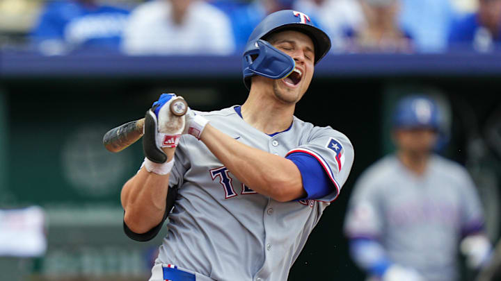 Texas Rangers shortstop Corey Seager (5) reacts after fouling a ball off of his leg during the ninth inning against the Kansas City Royals at Kauffman Stadium. 