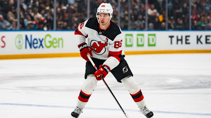 Jan 23, 2026; Vancouver, British Columbia, CAN; New Jersey Devils forward Jack Hughes (86) handles the puck against the Vancouver Canucks in the first period at Rogers Arena. Mandatory Credit: Bob Frid-Imagn Images